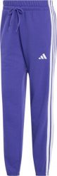 Adidas Spodnie damskie Essentials 3-Stripes French Terry Cuffed fioletowe KF8340 S. Fioletowe spodnie dresowe damskie Adidas, bez wzorów, sportowe. Za 231.11 zł.