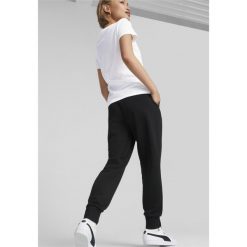 Damskie spodnie dresowe Essentials PUMA Black. Czarne spodnie dresowe damskie Puma, bez wzorów, z dresówki, sportowe, na fitness i siłownię. Za 179.00 zł.