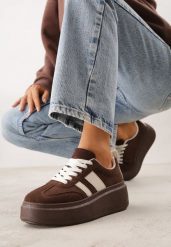 Brązowe Sneakersy Kultowe Tenisówki na Platformie z Koturnem Elisara. Brązowe trampki i tenisówki damskie Born2be, bez wzorów, z jeansu, bez zapięcia. Za 99.99 zł.