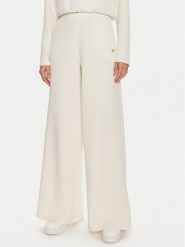Guess Spodnie dresowe Olympe V4YB07 KCAY2 Beżowy Relaxed Fit. Brązowe spodnie dresowe damskie Guess, z aplikacjami, z dresówki. Za 269.99 zł.