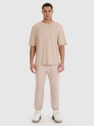 4F T-shirt oversize z modalem męski - beżowy S. Brązowe t-shirty męskie 4F, m, bez wzorów, z bawełny, bez kołnierzyka, bez ramiączek. W wyprzedaży za 59.99 zł.