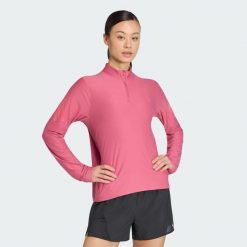 Bluza adi365 Iconic Running 1/2 Zip. Czarne bluzy damskie Adidas, m, bez wzorów, z dzianiny, klasyczne, bez ramiączek, bez kaptura. Za 216.90 zł.