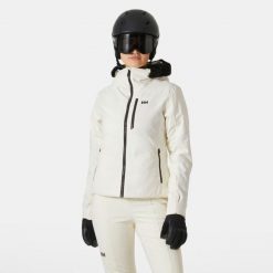 Damska kurtka narciarska Helly Hansen Valdisere 2.0. Białe kurtki sportowe damskie Helly Hansen, na zimę, bez wzorów, bez ramiączek, bez kaptura, narciarskie. W wyprzedaży za 1,243.50 zł.