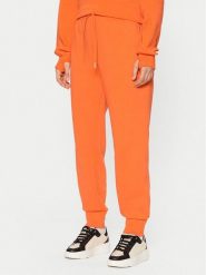 Lacoste Spodnie dresowe XF0343 Pomarańczowy Regular Fit. Brązowe spodnie dresowe damskie Lacoste, bez wzorów, z bawełny. Za 359.99 zł.
