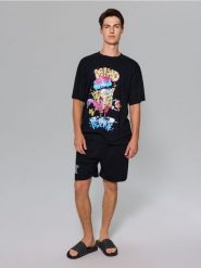 Bawełniana piżama dwuczęściowa SpongeBob - czarny. Czarne piżamy męskie Sinsay, l, bez wzorów, z bawełny, bez kołnierzyka, bez ramiączek. Za 45.99 zł.