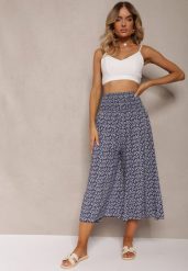 Granatowe Bawełniane Spodnie Culottes z Szeroką Gumką w Pasie i Kwiatowym Printem Pellagia. Niebieskie spodnie materiałowe damskie Renee, bez wzorów, z bawełny. Za 39.99 zł.