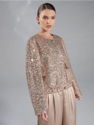 Żakiet z połyskującymi cekinami - złoty. Żółte marynarki i żakiety damskie Sinsay, bez wzorów, bez kołnierzyka, bez ramiączek. Za 69.99 zł.