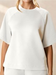 Bluza z krótkim rękawem soft touch - kremowy. Białe bluzy damskie Sinsay, l, bez wzorów, z dzianiny, bez ramiączek, bez kaptura. Za 39.99 zł.