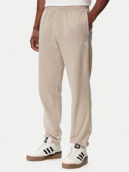 Adidas Spodnie dresowe Trefoil Essentials French Terry KT2454 Beżowy Regular Fit. Brązowe spodnie sportowe męskie Adidas, m, bez wzorów, z bawełny. Za 239.99 zł.