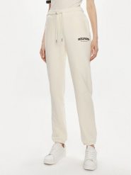 Tommy Hilfiger Spodnie dresowe Monotype WW0WW41572 Beżowy Regular Fit. Brązowe spodnie dresowe damskie Tommy Hilfiger, bez wzorów, z bawełny. Za 389.99 zł.