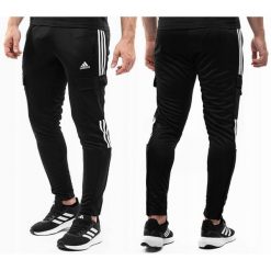 Męskie spodnie dresowe adidas Tiro Cargo czarne. Czarne spodnie materiałowe męskie Adidas, m, bez wzorów, z dresówki, do piłki nożnej. Za 229.99 zł.