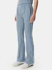 Lacoste Spodnie dresowe XF9313 Niebieski jasny Regular Fit. Niebieskie spodnie dresowe damskie Lacoste, bez wzorów, z bawełny. Za 739.99 zł.