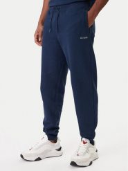 Guess Spodnie dresowe Z6RB12 KAIJ1 Granatowy Regular Fit. Niebieskie spodnie sportowe męskie Guess, m, z aplikacjami, z bawełny. Za 299.99 zł.