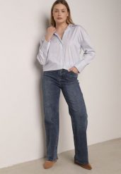 Niebieskie Jeansy z Wysokim Stanem i Szerokimi Nogawkami Henivia. Niebieskie jeansy damskie Born2be, bez wzorów, z jeansu, eleganckie, z podwyższonym stanem. Za 129.99 zł.