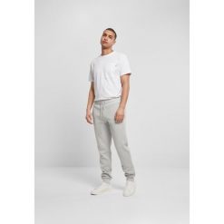 Spodnie Urban Classics basic. Szare spodnie materiałowe męskie Urban Classics, bez wzorów, z dresówki. Za 198.50 zł.