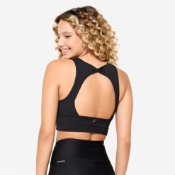 Stanik sportowy Decathlon crop top. Czarne koszulki sportowe damskie Decathlon, l, bez wzorów, bez ramiączek, na jogę i pilates. Za 89.99 zł.