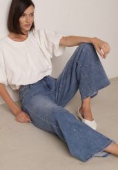 Niebieskie Szerokie Jeansy z Wysokim Stanem i Błyszczącymi Aplikacjami Glysera. Niebieskie jeansy damskie Born2be, z aplikacjami, z jeansu, eleganckie, z podwyższonym stanem. Za 119.99 zł.