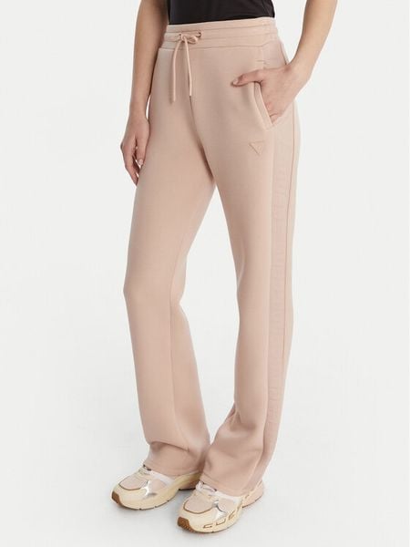Guess Spodnie dresowe V3RB21 K7UW2 Beżowy Regular Fit. Brązowe spodnie dresowe damskie Guess, z aplikacjami, z dresówki. Za 399.99 zł.