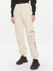 Calvin Klein Jeans Spodnie dresowe Bold Monologo J20J222606 Żółty Relaxed Fit. Żółte spodnie dresowe damskie Calvin Klein Jeans, bez wzorów, z dresówki. Za 329.99 zł.