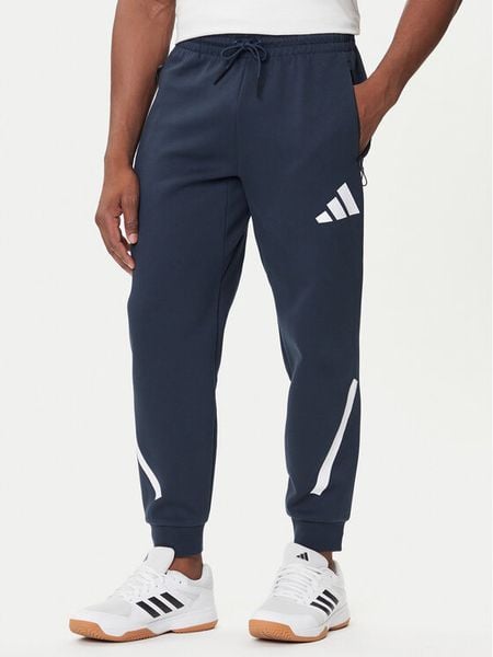 Adidas Spodnie dresowe Z.N.E. JW4723 Granatowy Loose Fit. Niebieskie spodnie sportowe męskie Adidas, l, bez wzorów, z bawełny. Za 299.99 zł.
