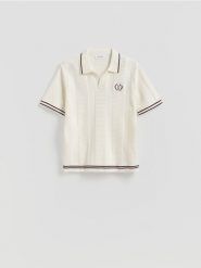 Sweter polo - złamana biel. Swetry męskie Reserved, l, bez wzorów, z bawełny, bez kołnierzyka, bez ramiączek. Za 139.99 zł.