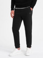 Spodnie męskie dresowe z przeszyciami na nogawkach - czarne V1 OM-PASK-0128 - XXL. Czarne spodnie sportowe męskie Ombre Clothing, l, bez wzorów, z bawełny. W wyprzedaży za 49.99 zł.