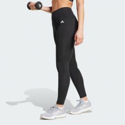 Długie legginsy Optimé Essentials Stash Pocket. Czarne legginsy damskie Adidas, bez wzorów, z elastanu. Za 157.99 zł.