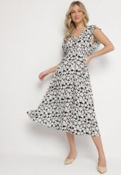 Czarna Bawełniana Sukienka w Kwiatki o Rozkloszowanym Kroju z Gumką Alanilia. Czarne sukienki damskie Born2be, na co dzień, na lato, l, bez wzorów, z bawełny, eleganckie, bez kołnierzyka, bez ramiączek, maxi, kopertowe. Za 49.99 zł.