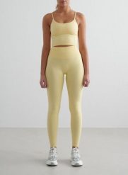 Damskie legginsy bezszwowe, wysoki stan, squat proof petite Shape żółty mellow. Żółte legginsy damskie Aim'n, bez wzorów, z elastanu. Za 296.00 zł.