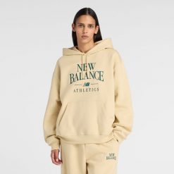 Bluza damska New Balance WT61U6QSABC - żółta. Żółte bluzy damskie New Balance, m, bez wzorów, z bawełny, klasyczne, bez ramiączek, bez kaptura. Za 299.99 zł.