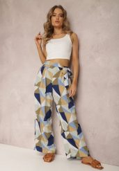 Niebieskie Spodnie Thaelene. Niebieskie spodnie materiałowe damskie Renee, z aplikacjami, z jeansu, długie. Za 54.99 zł.