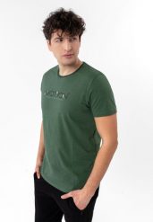 T-shirt z nadrukiem TM-MOTION. Zielone t-shirty męskie Volcano, l, z aplikacjami, z bawełny, bez kołnierzyka, bez ramiączek. Za 69.99 zł.