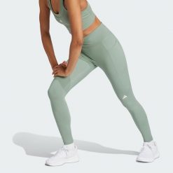 Legginsy Own the Run 7/8. Zielone legginsy damskie Adidas, bez wzorów, z materiału. W wyprzedaży za 228.30 zł.