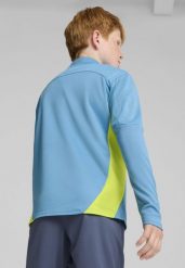 Młodzieżowa bluza treningowa Manchester City F.C. z zamkiem 1/4 PUMA. Niebieskia bluzy damskie Puma, m, bez wzorów, klasyczne, bez ramiączek, bez kaptura. Za 304.50 zł.