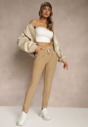 Beżowe Dopasowane Spodnie High Waist z Gumką i Wiązaniem w Talii Zelpia. Brązowe spodnie materiałowe damskie Renee, bez wzorów, z jeansu, eleganckie, z podwyższonym stanem. Za 44.99 zł.