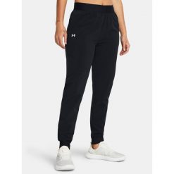 Spodnie treningowe damskie Under Armour Sport High Rise Woven. Czarne spodnie dresowe damskie Under Armour, bez wzorów, sportowe. Za 189.99 zł.