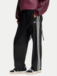 Adidas Spodnie dresowe 2In1 Firebird Loose Track Trousers With Lace Skirt LG4271 Czarny Relaxed Fit. Czarne spodnie sportowe damskie Adidas, bez wzorów, z dresówki. Za 369.99 zł.