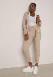 Beżowy Komplet Dresowy Zasuwana Bluza z Kapturem i Spodnie Typu Jogger Nedisare. Brązowe bluzy damskie Born2be, l, bez wzorów, z dresówki, eleganckie, bez ramiączek, z kapturem. Za 89.99 zł.
