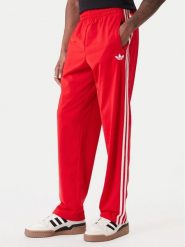 Adidas Spodnie dresowe Firebird KD8319 Czerwony Loose Fit. Czerwone spodnie sportowe męskie Adidas, m, bez wzorów, z dresówki. Za 279.99 zł.