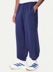Adidas Spodnie dresowe Soft Lux KS2775 Niebieski Loose Fit. Niebieskie spodnie sportowe męskie Adidas, m, bez wzorów, z dresówki. Za 329.99 zł.