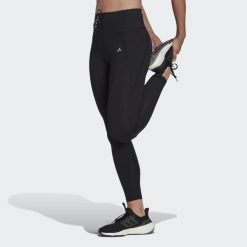 Legginsy Running Essentials. Czarne legginsy damskie Adidas, bez wzorów, z materiału. W wyprzedaży za 139.30 zł.