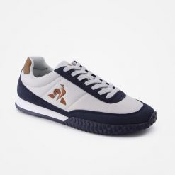 Buty sportowe damskie Veloce Ripstop ombre blue. Niebieskie obuwie sportowe damskie le coq sportif, bez wzorów, bez zapięcia, trekkingowe. W wyprzedaży za 367.55 zł.