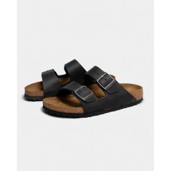 Klapki Birkenstock 552113. Czarne klapki męskie Birkenstock, bez wzorów, z materiału, bez zapięcia. Za 814.00 zł.
