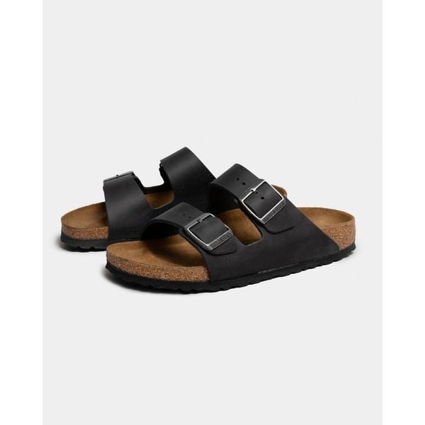 Klapki Birkenstock 552113. Czarne klapki męskie Birkenstock, bez wzorów, z materiału, bez zapięcia. Za 844.00 zł.