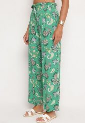 Zielone Spodnie z Bawełny z w Stylu Boho z Szerokimi Nogawkami i Gumką w Talii Jelvia. Zielone spodnie materiałowe damskie Born2be, na lato, bez wzorów, z bawełny, boho. Za 49.99 zł.
