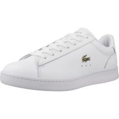 Tenisówki Lacoste Model Carnaby Kolor Biały. Białe trampki i tenisówki damskie Lacoste, bez wzorów, ze skóry, bez zapięcia. Za 389.99 zł.