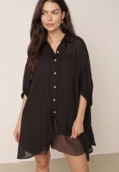 Czarna Zwiewna Koszula Letnia Oversize z Bawełny o Nietoperzowym Kroju Canomela. Czarne koszule damskie Born2be, l, bez wzorów, z bawełny, eleganckie, bez kołnierzyka, bez ramiączek. Za 139.99 zł.