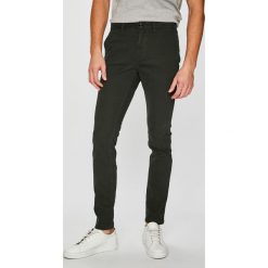 Tommy Hilfiger - Spodnie. Zielone eleganckie spodnie męskie Tommy Hilfiger, bez wzorów, z bawełny. W wyprzedaży za 319.90 zł.