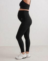 Damskie legginsy ciążowe prążkowane, bezszwowe Ribbed Seamless czarne. Czarne legginsy damskie Aim'n, bez wzorów, z dzianiny. Za 258.00 zł.