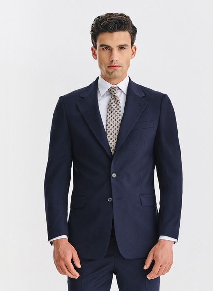 PAKO LORENTE - Wełniana granatowa marynarka garniturowa. Garnitury męskie Pako Lorente, bez wzorów, z wełny, biznesowe, bez kołnierzyka, bez ramiączek. Za 1,699.99 zł.